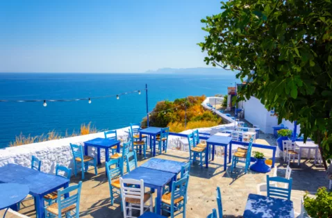 Blue chairs taverna terrace Skopelos Greece web
