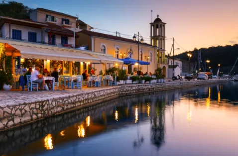 Vathi harbour taverna evening Meganisi Greece web