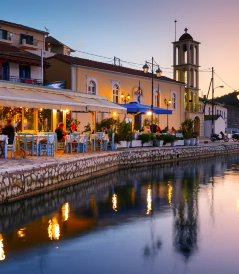 Vathi harbour taverna evening Meganisi Greece web